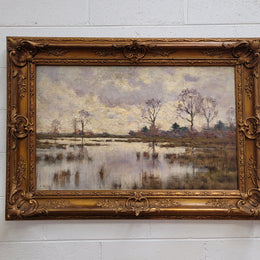 Sourced from France an impressionist oil painting of a beautiful lake scene. It is nicely framed in an Antique frame and in good original detailed condition.