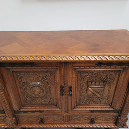 Large French Oak Renaissance style four door sideboard/buffet. Great decorative item with amazing carvings and stunning iron work on base. It is in good original detailed condition. Can pull apart completely making it easier to move.