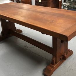 Lovely Oak French Farmhouse table with a thick plank top and lovely stretcher base. Can comfortable seat 8-10 people and is in good original detailed condition.