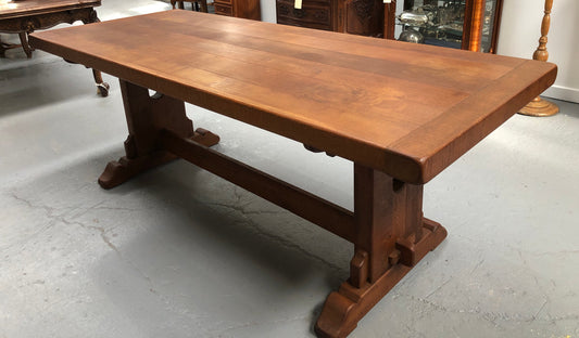 Lovely Oak French Farmhouse table with a thick plank top and lovely stretcher base. Can comfortable seat 8-10 people and is in good original detailed condition.