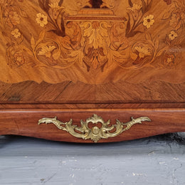 Elegant French transitional style Walnut & Kingwood Salon cabinet. It has beautiful marquetry inlay, a marble top and decorative ormolu mounts. Sourced From France and is in good original detailed condition.