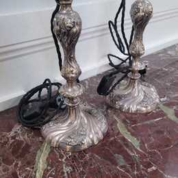 Pair of Antique French Silver candlestick table lamps with new wiring. In good original condition.