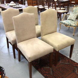 Beautiful set of four upholstered taupe/ light fawn dining chairs which are very comfortable to sit in. They are in good original condition.