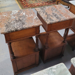A Superb pair of Henry II style marble top French Antique bedside cabinets. They have a drawer at the top, an open shelf in the middle and a cupboard at the bottom. They have been sourced from France and are in good original detailed condition.