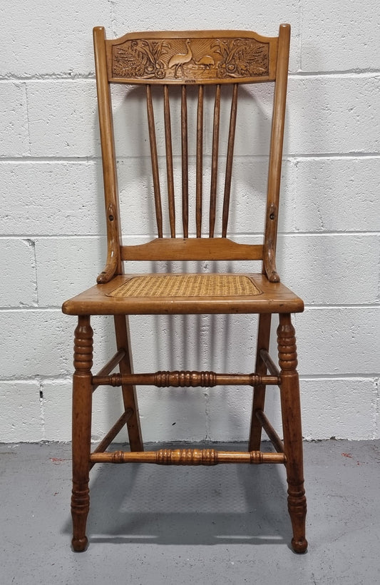 Australian Emu chair with cane inset seat. In good original condition.