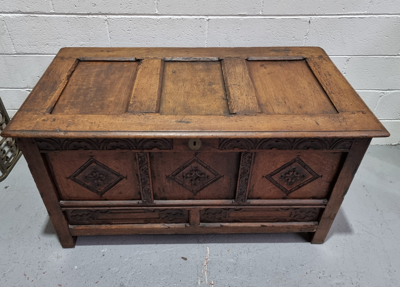 Early 19th Century French Oak carved coffer with a lift up lid for storage. A beautiful piece and in good original condition.