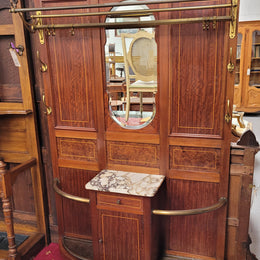 Attractive French Burr Walnut Hallstand. It has a single drawer, cupboard, brass rods, umbrella storage and a marble shelf. It is in good original condition. Please see photos as they form part of the description.