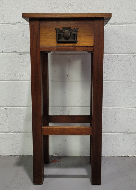Small Arts and Crafts side table/bedside table. With drawer and is in good original detailed condition.