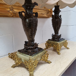 Pair of decorative Antique French gilt bronzed metal and marble table lamps. In good original detailed working condition.