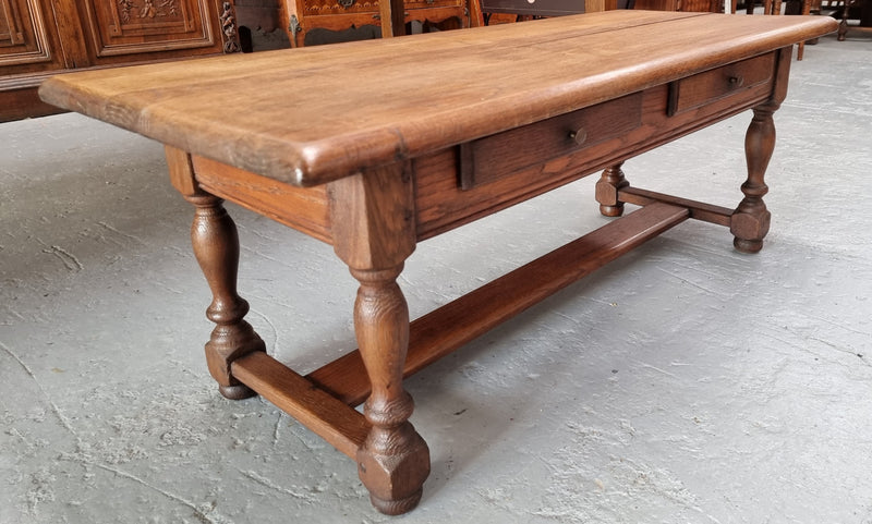 Fabulous Rustic French Oak coffee table with two drawers. It is in good original detailed condition.