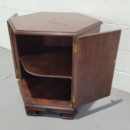 Hexagonal Mahogany enclosed side cabinet with two doors. Would make an ideal side cabinet and is in good restored condition.