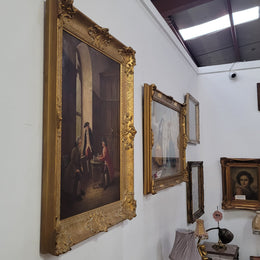 An engaging gilt framed signed oil on canvas of a "French Interior Scene". It has been sourced from France and is in good original detailed condition.