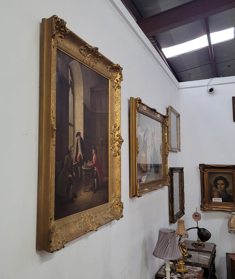 An engaging gilt framed signed oil on canvas of a "French Interior Scene". It has been sourced from France and is in good original detailed condition.