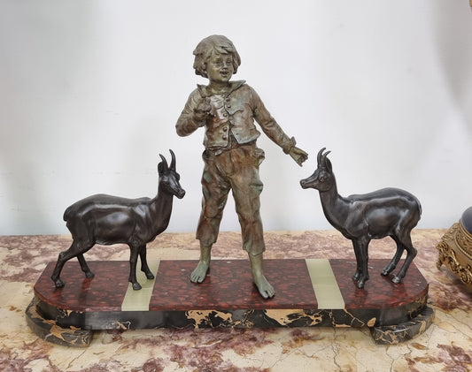 French Art Deco spelter and marble statue of a boy and two deers in good original condition.