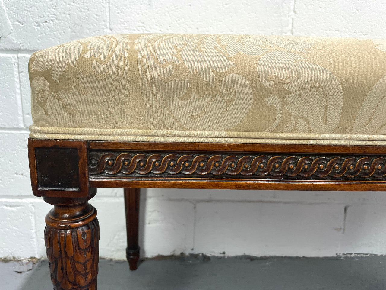 Nicely carved French Louis XVI style Walnut upholstered stool. The stool is in good condition and the frabic is in good used condition, please view photos as they help form part of the description.