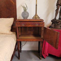 French Art Deco bedroom suite consisting of queen size bed in Amboyna wood and featuring pretty inlay. It comes with a matching pair of bedsides. It is a very stylish and high quality suite. It has been sourced from France and is in good original detailed condition.