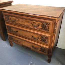 Gorgeous Provincial oak and parquetry top commode. It has beautiful carved Details and in good original detailed condition.