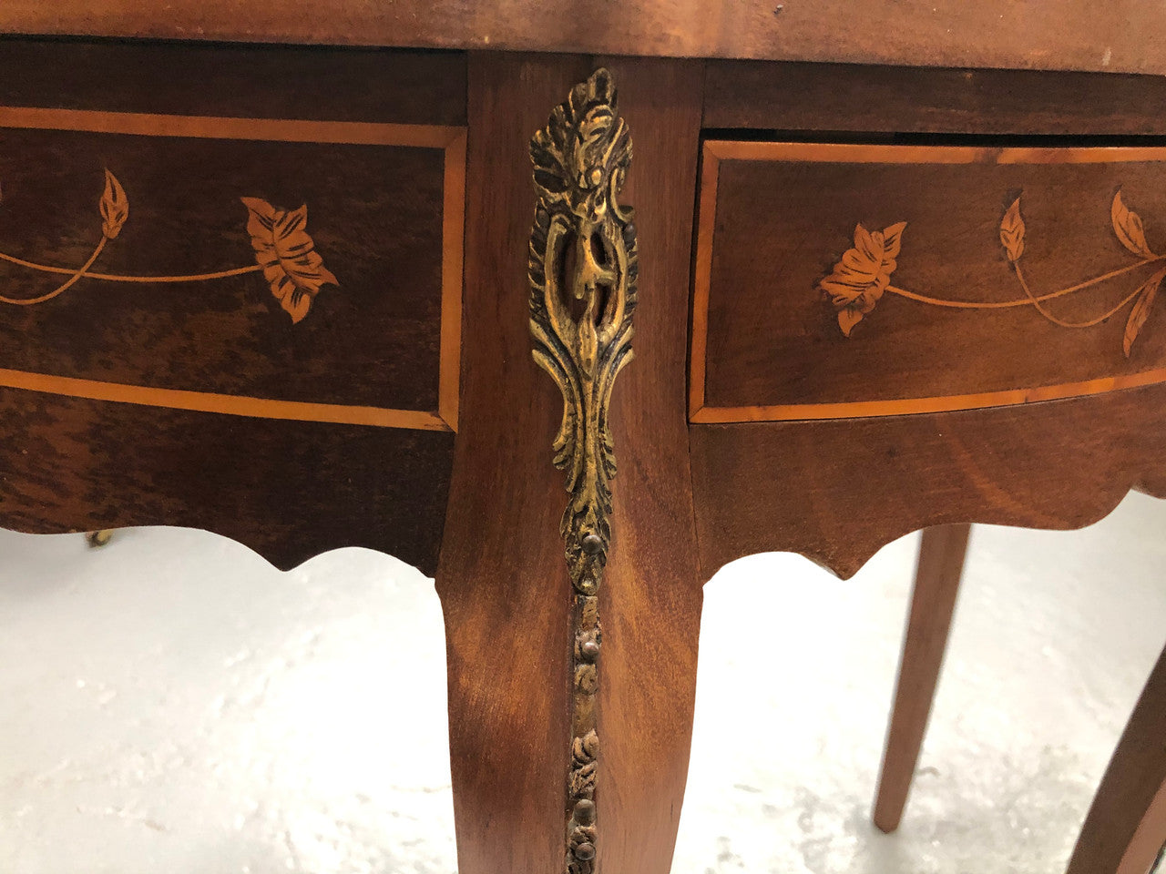 Stunning small inlaid French Walnut Louis XV style hall table with ormolu mounts and beautiful details. It has been sourced from France and is in good orignal detailed condition.