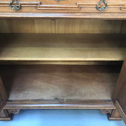 Beautiful carved French Oak four-door buffet with three drawers and lots of room for storage in good original detailed condition.