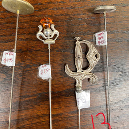 We stock a range of assorted Vintage/Antique hatpins which start from $6. Please view photos to see our current range. You are able to purchase our hat pins by either emailing us or calling us to confirm availability and prices.