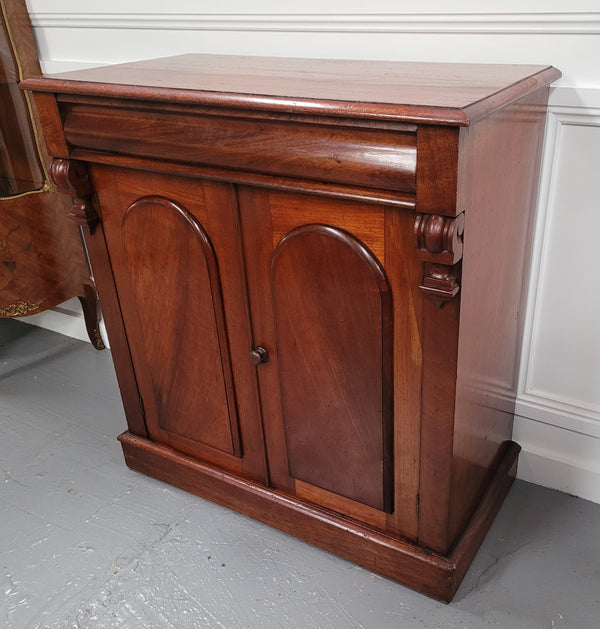 Cedar side cabinet with two doors one drawer and lovely door panels and corbels. It has been sourced locally and is in good original detailed condition.