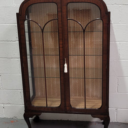 Chippendale style Walnut display cabinet of pleasing narrow portions. It is in good original condition and comes with three shelves.