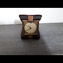 Art Deco "Emes" travel clock in original leather case. In good working order.