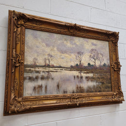 Sourced from France an impressionist oil painting of a beautiful lake scene. It is nicely framed in an Antique frame and in good original detailed condition.