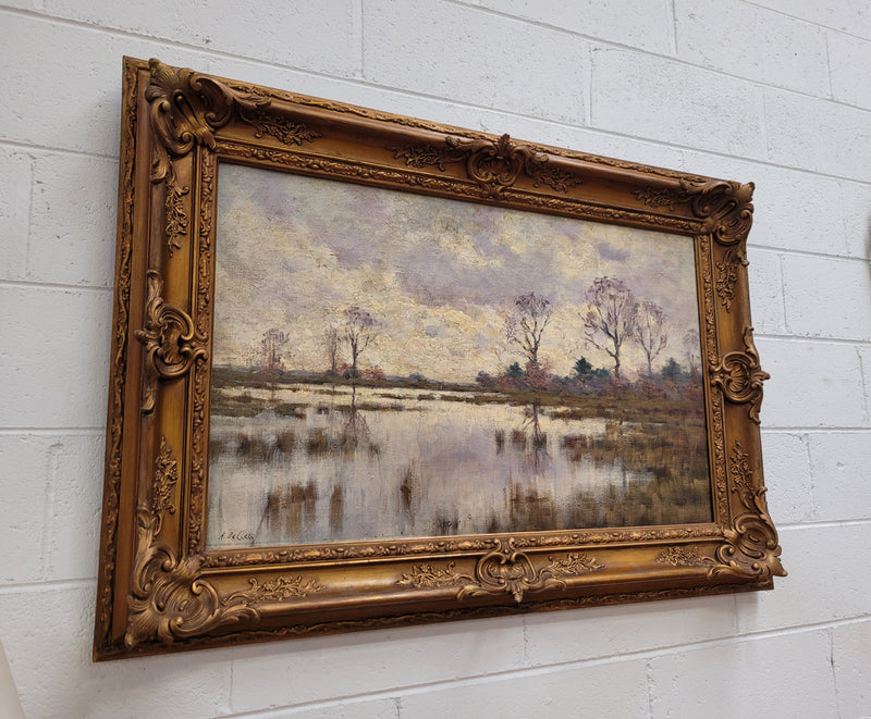 Sourced from France an impressionist oil painting of a beautiful lake scene. It is nicely framed in an Antique frame and in good original detailed condition.