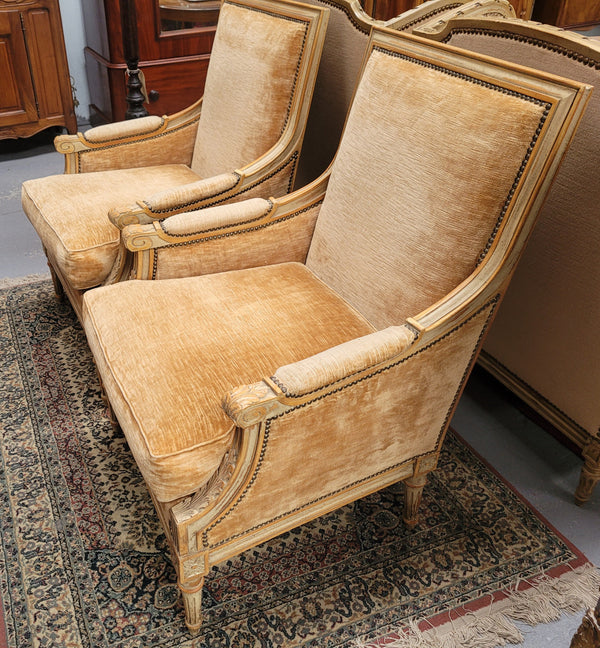 Pair of Louis XVI style painted arm chairs with carving & fluted legs. They have been sourced from France and the fabric is in good used original condition. Please view photos as they help form part of the description.