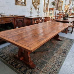Reclaimed Pine and Oregon stretcher base dining table. The top has an amazing patina and character. Can very comfortable seat 12 and is in good original detailed condition .