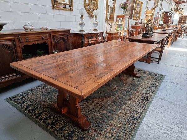 Reclaimed Pine and Oregon stretcher base dining table. The top has an amazing patina and character. Can very comfortable seat 12 and is in good original detailed condition .