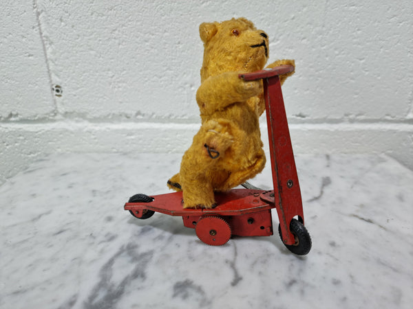 "Gebruder Fendi" bear riding scooter wind up toy, comes with original key. In good original condition, please view photos as they help form part of the description.