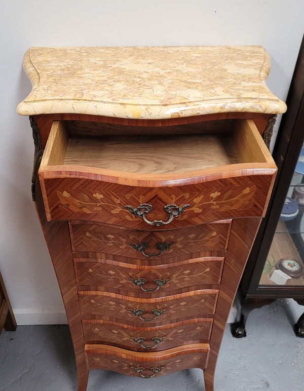 Stunning French seven drawer Kingwood and marquetry inlaid semainier with a beautiful marble top. In good original detailed condition.