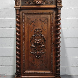 French Henry 2nd Oak Side Cabinet of pleasing narrow proportions.  Carving on the cup board and drawer fronts with barley twist columns.