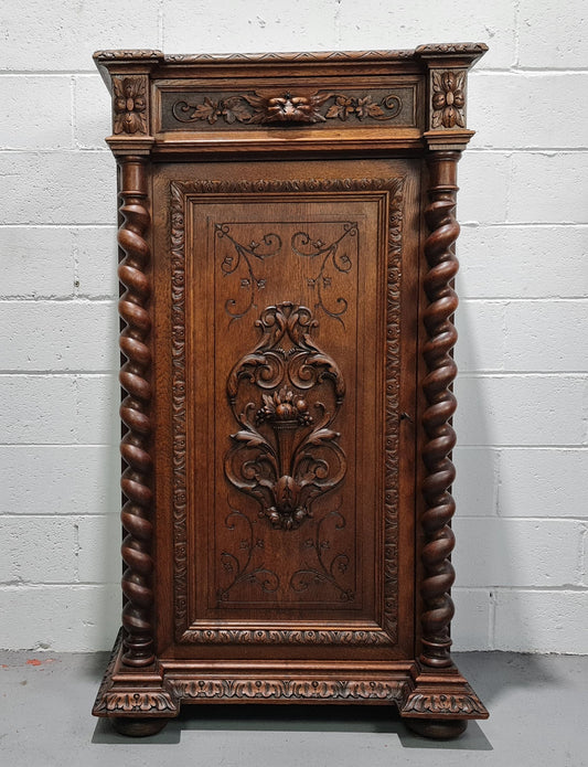 French Henry 2nd Oak Side Cabinet of pleasing narrow proportions.  Carving on the cup board and drawer fronts with barley twist columns.