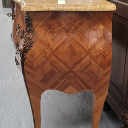 An elegant French Louis XV style kingwood two drawer commode with beautiful decorative inlay and ormolu mounts. Stunning coloured marble top and is in good original detailed condition.