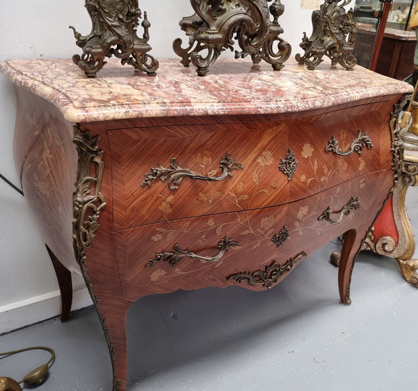 Stunning Louis XV style marquetry inlay marble top two drawer commode. It has decorative ormolu mounts and beautiful marble top. In good original detailed condition.