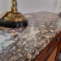 A high quality 19th Century French marquetry inlaid Kingwood marble top credenza. It has an attractive solid marble top and decorative marquetry inlay throughout. It has plenty of storage space with three drawers and three doors. It has been sourced from France and is in good original detailed condition.