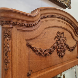 Beautiful French Oak Louis XV style carved trumeau mirror with beautiful detail. In good original detailed condition.