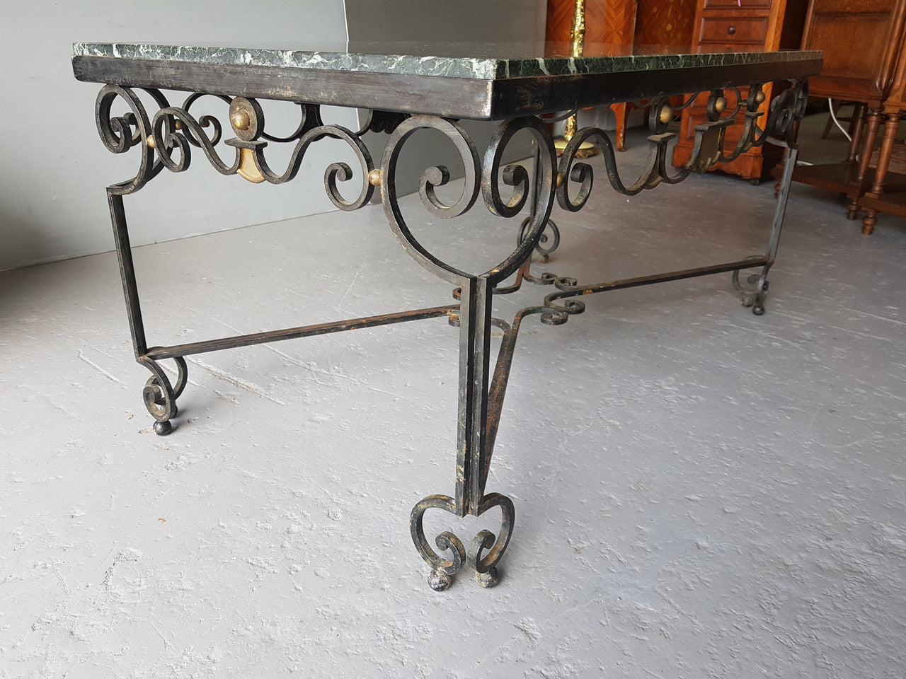 Wrought iron Coffee Table With An Attractive Green Marble Top