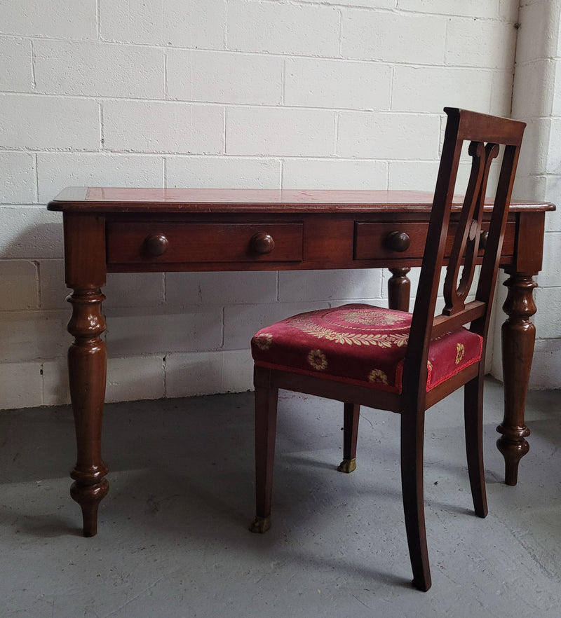 Victorian Cedar two drawer tooled leather topped desk with turned legs. In good original condition.