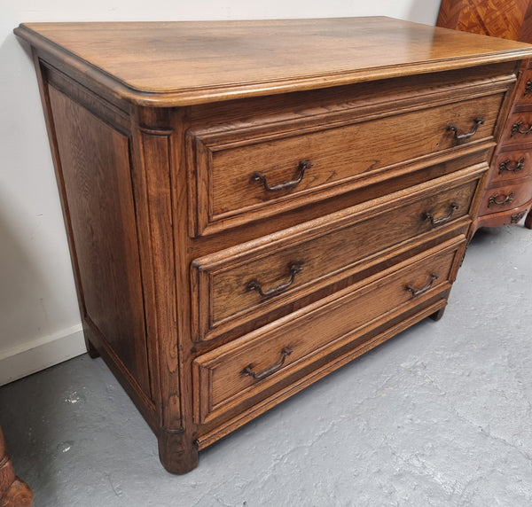 French solid Oak Louis 14th style chest of three drawers. It has three large spacious drawers and it has been sourced from France. It is in good original detailed condition.