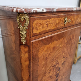 Elegant French transitional style Walnut & Kingwood Salon cabinet. It has beautiful marquetry inlay, a marble top and decorative ormolu mounts. Sourced From France and is in good original detailed condition.