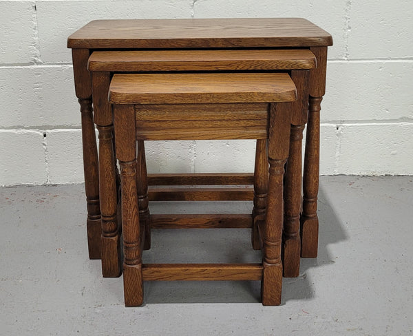 Lovely tudor oak style three nest tables. Circa 1950, In good original detailed condition.