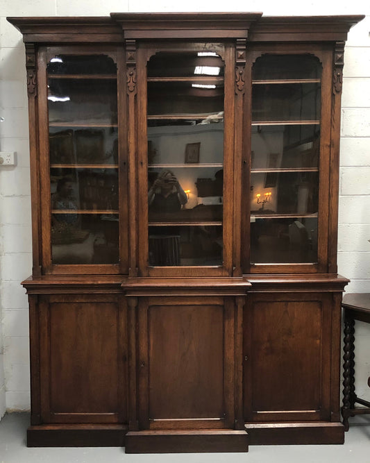 Amazing six-door Oak English bookcase sourced from France. The top section has adjustable shelves and plenty of storage space below which has fixed shelves. Keys and locks in working condition. In good original detailed condition. Circa 1880.