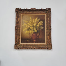 French floral still life painting oil on canvas of Wattle in a vase in a stunning decorative frame in good condition. Signed by artist and has been sourced from France.