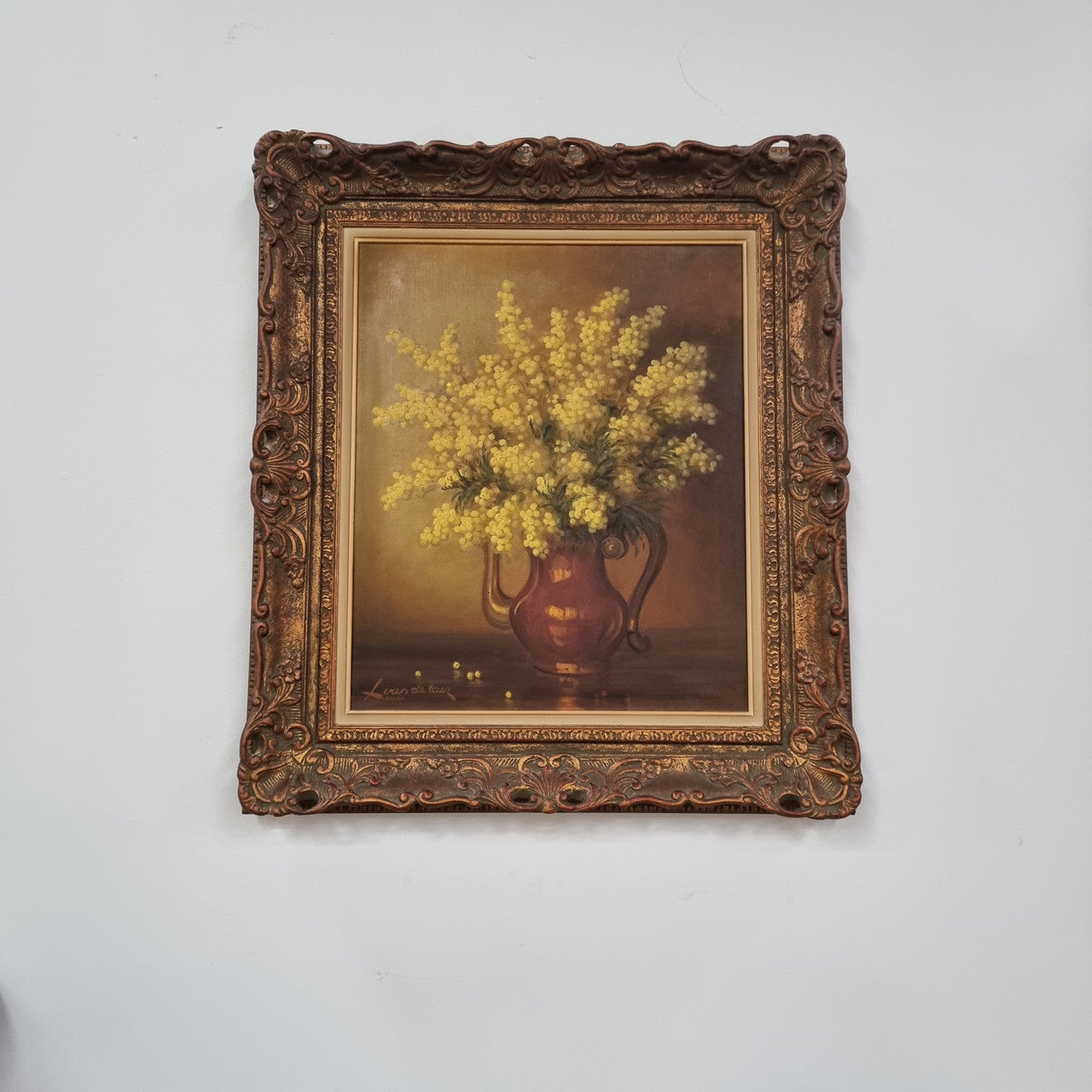 French floral still life painting oil on canvas of Wattle in a vase in a stunning decorative frame in good condition. Signed by artist and has been sourced from France.