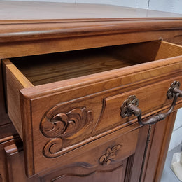 French Walnut two door buffet with parquetry top. It has two drawers and an adjustable shelf. In good original detailed condition and it has been sourced from France.