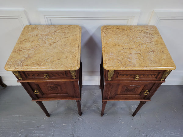 French Oak pair of Louis 16th style marble top bedsides with stunning bronze mounts. They have been sourced from France and are in good original detailed condition.